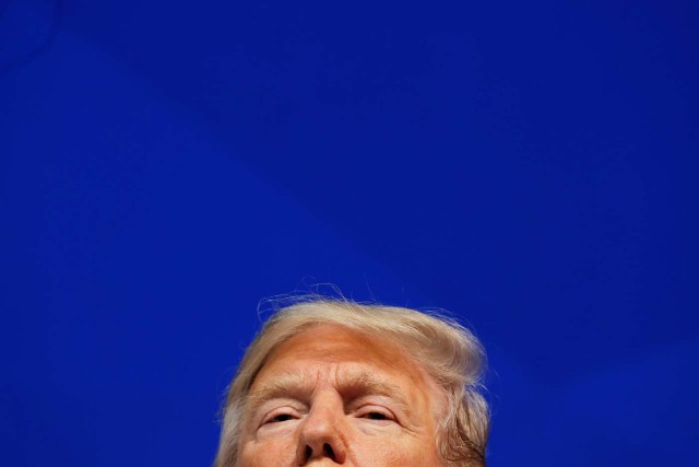 U.S. President Donald Trump looks on during the World Economic Forum (WEF) annual meeting in Davos, Switzerland January 26, 2018. REUTERS/Carlos Barria