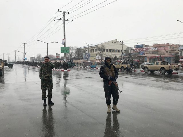 Afghan security forces stand near the Marshal Fahim military academy after a series of explosions in Kabul, Afghanistan January 29, 2018. REUTERS/Mohammad Ismail