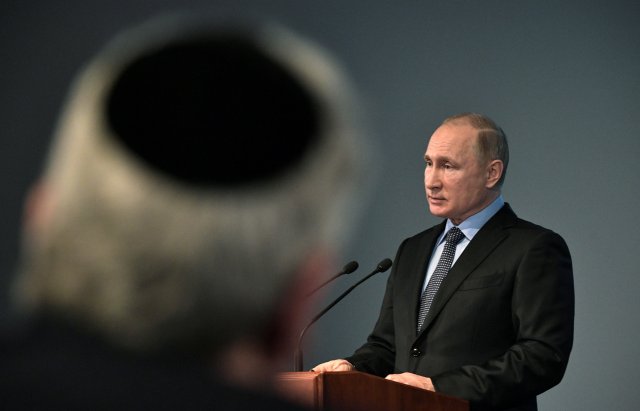 Russian President Vladimir Putin delivers a speech during an event marking the International Holocaust Victims Remembrance Day and the 75th anniversary of the breakthrough the Nazi Siege of Leningrad in the World War II, at the Jewish Museum and Tolerance Centre in Moscow, Russia January 29, 2018. Sputnik/Alexei Nikolsky/Kremlin via REUTERS ATTENTION EDITORS - THIS IMAGE WAS PROVIDED BY A THIRD PARTY.
