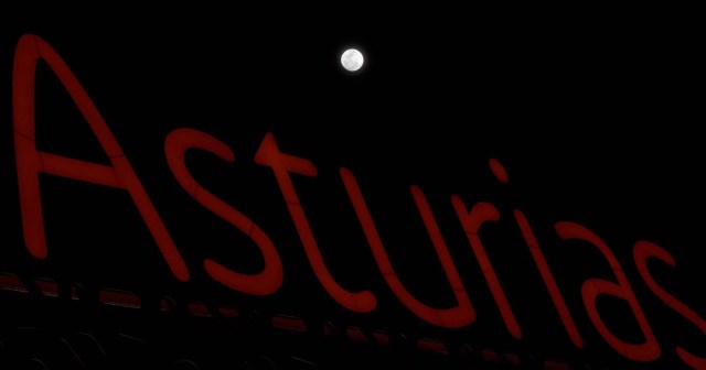 A full moon 'super moon' is seen above a luminous sign with the name of the region "Asturias" in Siero, Spain, January 30, 2018. REUTERS/Eloy Alonso