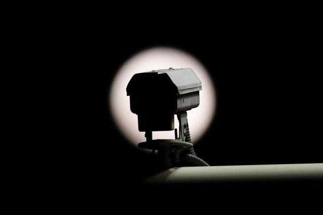 A security camera is seen in front of the super blue moon outside the Forbidden City in Beijing, China January 31, 2018. REUTERS/Damir Sagolj