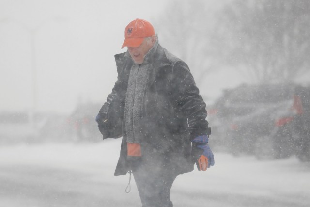 A man crosses the street during a blizzard in Long Beach, New York, U.S. January 4, 2018. REUTERS/Shannon Stapleton