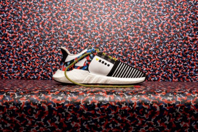 epa06427722 A handout photo made available by sports wear company adidas on 09 January 2018 shows the new sneaker model 'EQT Support 93/Berlin' with design elements of the grafitti covering pattern of Berlin's subway seat upholstery, placed on a subway seat in Berlin, Germany. According to Berlin's public transport company the bying of the BVG sneaker is combined with a one-year-ticket for Berlin's public transport network valid from 16 January to 31 December 2018. The edition of this model is limited to 500 pairs. EPA/ADIDAS HANDOUT HANDOUT EDITORIAL USE ONLY/NO SALES