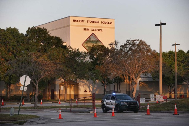 A general view of Marjory Stoneman Douglas High School as staff and teachers prepare for the return of students in Parkland, Florida on February 27, 2018. Florida's Marjory Stoneman Douglas high school will reopen on February 28, 2018 two weeks after 17 people were killed in a shooting by former student, Nikolas Cruz, leaving 17 people dead and 15 injured on February 14, 2018. / AFP PHOTO / RHONA WISE