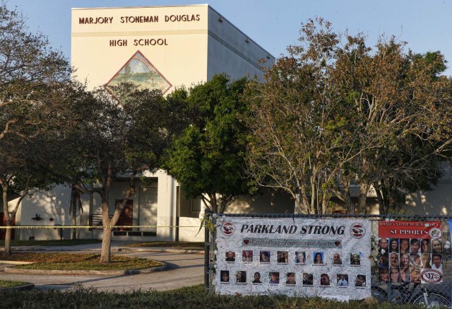 A general view of Marjory Stoneman Douglas High School as staff and teachers prepare for the return of students in Parkland, Florida on February 27, 2018. Florida's Marjory Stoneman Douglas high school will reopen on February 28, 2018 two weeks after 17 people were killed in a shooting by former student, Nikolas Cruz, leaving 17 people dead and 15 injured on February 14, 2018. / AFP PHOTO / RHONA WISE