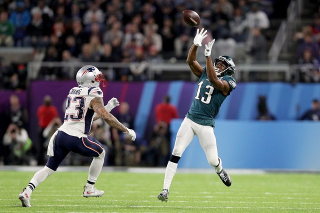 MINNEAPOLIS, MN - FEBRUARY 04: Nelson Agholor #13 of the Philadelphia Eagles makes a catch over Patrick Chung #23 of the New England Patriots during the fourth quarter in Super Bowl LII at U.S. Bank Stadium on February 4, 2018 in Minneapolis, Minnesota. Patrick Smith/Getty Images/AFP