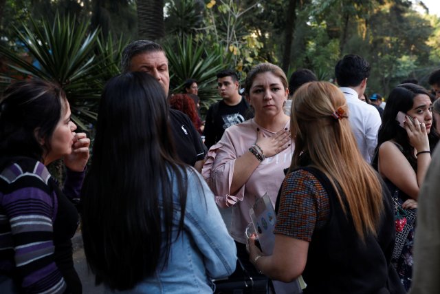 People react during a tremor in Mexico City, Mexico February 16, 2018. REUTERS/Carlos Jasso