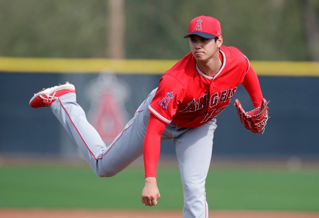 Feb 17, 2018; Tempe, AZ, USA; Los Angeles Angels starting pitcher Shohei Ohtani (17) throws off the mound to minor league players during camp at Tempe Diablo Stadium. Mandatory Credit: Rick Scuteri-USA TODAY Sports