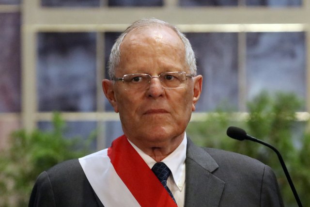 FILE PHOTO: Peru's President Pedro Pablo Kuczynski attends a swearing-in ceremony at the Government Palace in Lima, Peru January 9, 2018. REUTERS/Guadalupe Pardo/File Photo