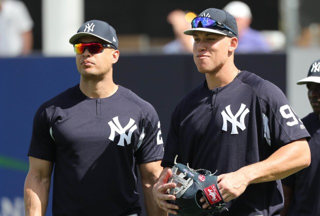 Feb 20, 2018; Tampa, FL, USA; New York Yankees right fielder Aaron Judge (99) and right fielder Giancarlo Stanton (27) during spring training at George M. Steinbrenner Field. Mandatory Credit: Kim Klement-USA TODAY Sports