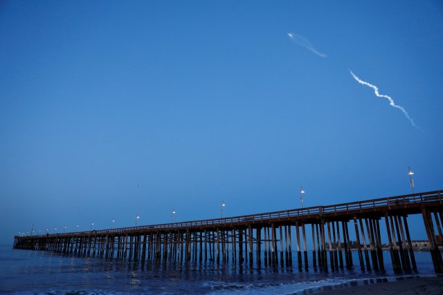 The SpaceX Falcon 9 rocket carrying a PAZ Earth Observation satellite is launched from Vandenberg Air Force Base (AFB) as seen over the Ventura Pier in Ventura, California, U.S., February 22, 2018. REUTERS/Patrick T. Fallon