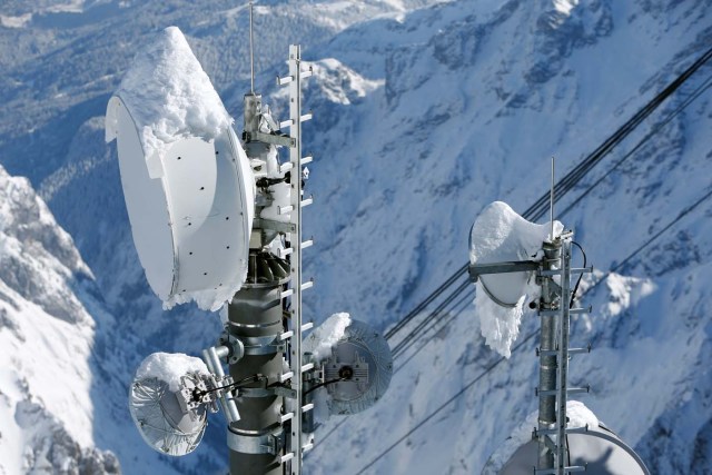 Snow covered transmitting antennas are pictured on top of the highest German mountain, the Zugspitze, in Garmisch-Partenkirchen, Germany February 28, 2018. REUTERS/Michaela Rehle