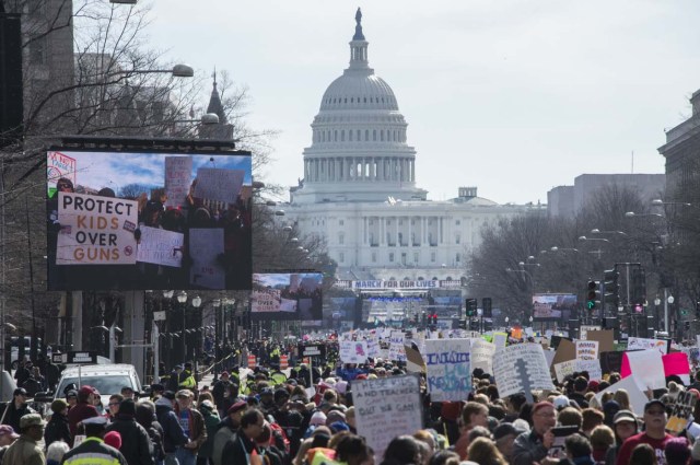 Participants take part in the March for Our Lives Rally in Washington, DC on March 24, 2018. Bundled against the cold but fired up with passion after a Florida high school massacre, crowds gathered in Washington on Saturday for what is expected to be the biggest US gun control protest in a generation, with hundreds of thousands attending.The student-organized protest is to feature rallies from coast to coast, with the main event in Washington within sight of the US Capitol -- whose lawmakers the protesters hope to influence. / AFP PHOTO / ANDREW CABALLERO-REYNOLDS