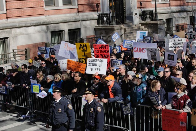 Participants take part in the March for Our Lives Rally in New York on March 24, 2018. Bundled against the cold but fired up with passion after a Florida high school massacre, crowds gathered in Washington on Saturday for what is expected to be the biggest US gun control protest in a generation, with hundreds of thousands attending.The student-organized protest is to feature rallies from coast to coast, with the main event in Washington within sight of the US Capitol -- whose lawmakers the protesters hope to influence. / AFP PHOTO / Eduardo MUNOZ ALVAREZ