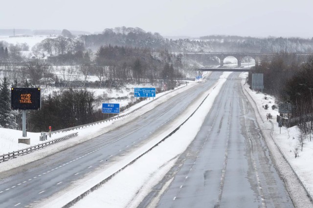 The M80 motorway is completely empty after being closed to clear vehicles stranded by bad weather overnight, near Banknock, Scotland, Britain March 1, 2018. REUTERS/Russell Cheyne