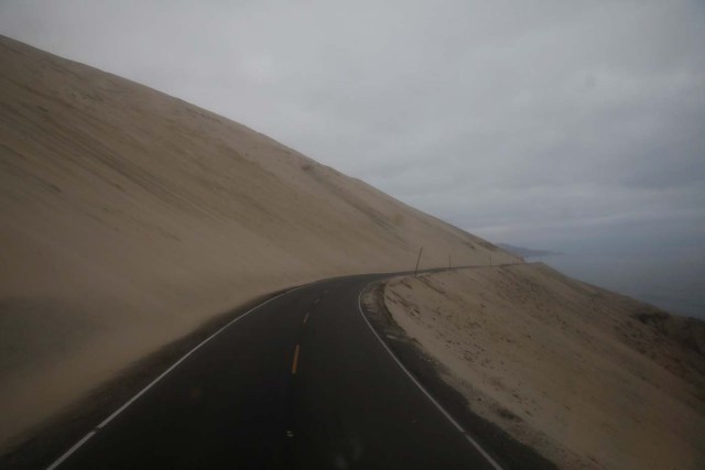 The road winds around the side of a hill in Atico, Peru, November 13, 2017. Carlos Garcia Rawlins: "The view from the first row of seats on the top floor of the bus was amazing. At moments there was a feeling of emptiness as the road disappeared around a bend and mist descended and blurred the horizon. REUTERS/Carlos Garcia Rawlins SEARCH "RAWLINS BUS" FOR THIS STORY. SEARCH "WIDER IMAGE" FOR ALL STORIES.