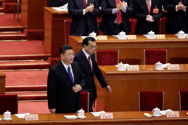 Chinese President Xi Jinping and Chinese Premier Li Keqiang arrive for the opening session of the Chinese People's Political Consultative Conference (CPPCC) at the Great Hall of the People in Beijing, China March 3, 2018. REUTERS/Jason Lee