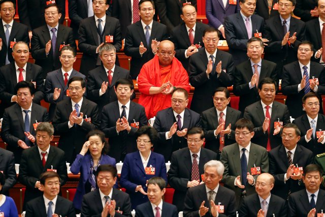 Delegates clap as Chinese President Xi Jinping and other top officials arrive for the opening session of the Chinese People's Political Consultative Conference (CPPCC) at the Great Hall of the People in Beijing, China March 3, 2018. REUTERS/Damir Sagolj