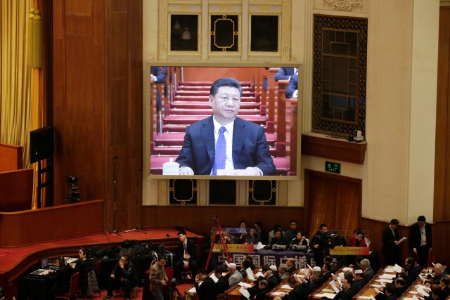 Chinese President Xi Jinping is seen on a giant screen at the opening session of the Chinese People's Political Consultative Conference (CPPCC) at the Great Hall of the People in Beijing, China March 3, 2018. REUTERS/Jason Lee