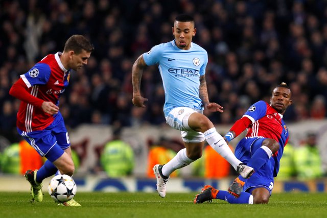 Soccer Football - Champions League Round of 16 Second Leg - Manchester City vs FC Basel - Etihad Stadium, Manchester, Britain - March 7, 2018   Manchester City's Gabriel Jesus in action with Basel’s Serey Die and Fabian Frei    Action Images via Reuters/Jason Cairnduff