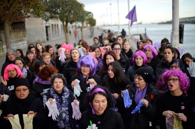 Protesters hold up gloves while taking part in a strike for women's rights in Portugalete, Spain, March 8, 2018, on International Women's Day. REUTERS/Vincent West