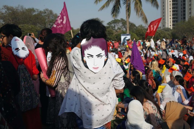 People wear masks depicting Qandeel Baloch, social media celebrity, who according to the police was strangled in what appeared to be an "honour killing" in 2016, as they take part in an Aurat March, or Women's March in Karachi, Pakistan March 8, 2018. REUTERS/Akhtar Soomro