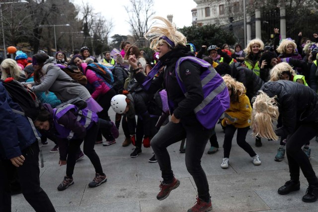 Women dance during a protest as as part of a nationwide feminist strike on International Women's Day in Madrid, Spain, March 8, 2018. REUTERS/Susana Vera