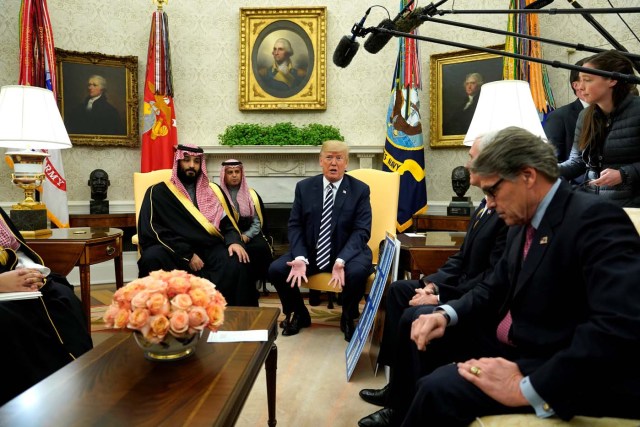 U.S. President Donald Trump, flanked by Energy Secretary Rick Perry, delivers remarks as he welcomes Saudi Arabia's Crown Prince Mohammed bin Salman in the Oval Office at the White House in Washington, U.S. March 20, 2018. REUTERS/Jonathan Ernst