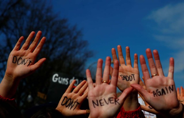 Attendees are seen before students and gun control advocates hold the "March for Our Lives" event demanding gun control after recent school shootings at a rally in Washington, U.S., March 24, 2018. REUTERS/Eric Thayer