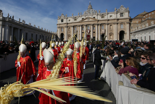 Cardinals arrive to attend the Palm Sunday Mass in Saint Peter's Square at the Vatican, March 25, 2018   REUTERS/Tony Gentile