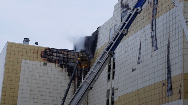 Members of the Emergency Situations Ministry work to extinguish a fire in a shopping mall in the Siberian city of Kemerovo, Russia March 26, 2018. Russian Emergencies Ministry/Handout via REUTERS. ATTENTION EDITORS - THIS IMAGE WAS PROVIDED BY A THIRD PARTY. NO RESALES. NO ARCHIVE.