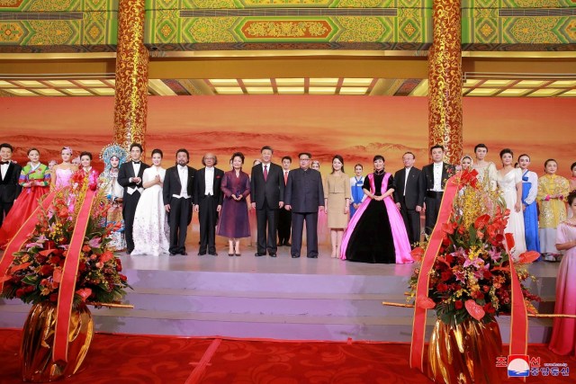 REFILE - ADDING CITY North Korean leader Kim Jong Un and wife Ri Sol Ju, and Chinese President Xi Jinping and wife Peng Liyuan attend a banquet, as Kim Jong Un paid an unofficial visit to Beijing, China, in this undated photo released by North Korea's Korean Central News Agency (KCNA) in Pyongyang March 28, 2018. KCNA/via Reuters ATTENTION EDITORS - THIS IMAGE WAS PROVIDED BY A THIRD PARTY. REUTERS IS UNABLE TO INDEPENDENTLY VERIFY THIS IMAGE. NO THIRD PARTY SALES. NOT FOR USE BY REUTERS THIRD PARTY DISTRIBUTORS. SOUTH KOREA OUT. NO COMMERCIAL OR EDITORIAL SALES IN SOUTH KOREA.