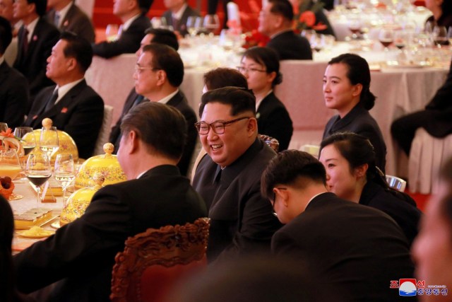 REFILE - ADDING CITY North Korean leader Kim Jong Un smiles during a banquet, as he paid an unofficial visit to Beijing, China, in this undated photo released by North Korea's Korean Central News Agency (KCNA) in Pyongyang March 28, 2018. KCNA/via Reuters ATTENTION EDITORS - THIS IMAGE WAS PROVIDED BY A THIRD PARTY. REUTERS IS UNABLE TO INDEPENDENTLY VERIFY THIS IMAGE. NO THIRD PARTY SALES. NOT FOR USE BY REUTERS THIRD PARTY DISTRIBUTORS. SOUTH KOREA OUT. NO COMMERCIAL OR EDITORIAL SALES IN SOUTH KOREA.