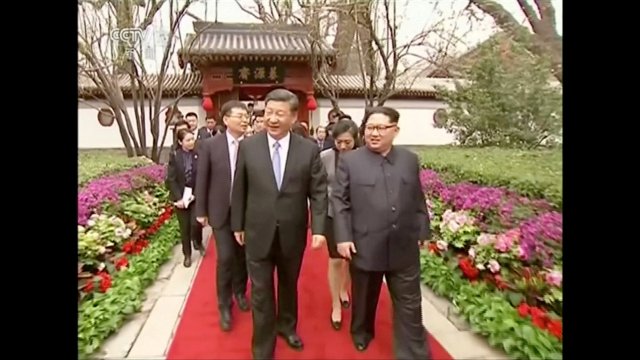 REFILE - ADDING CITY North Korean leader Kim Jong Un and Chinese President Xi Jinping walk as they talk, as Kim Jong Un paid an unofficial visit to Beijing, China, in this still image taken from video released on March 28, 2018. North Korean leader Kim Jong Un visited China from Sunday to Wednesday on an unofficial visit, China's state news agency Xinhua reported on Wednesday. CCTV via Reuters TV ATTENTION EDITORS - NO RESALES. NO ARCHIVES. CHINA OUT.