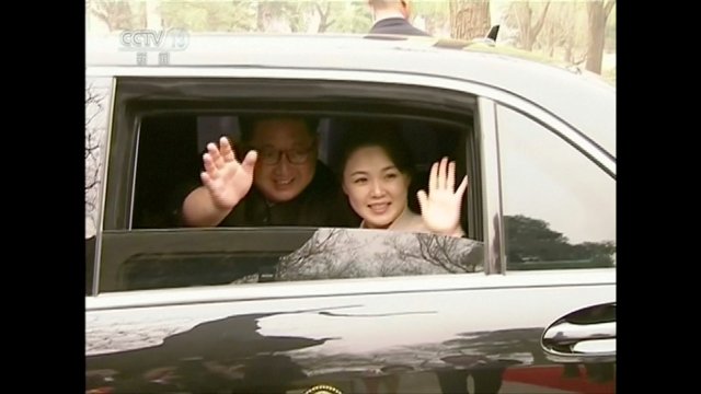 REFILE - ADDING CITY North Korean leader Kim Jong Un and his wife Ri Sol Ju wave and smile, in this still image taken from video released on March 28, 2018. North Korean leader Kim Jong Un visited Beijing, China from Sunday to Wednesday on an unofficial visit, China's state news agency Xinhua reported on Wednesday. CCTV via Reuters TV ATTENTION EDITORS - NO RESALES. NO ARCHIVES. CHINA OUT.