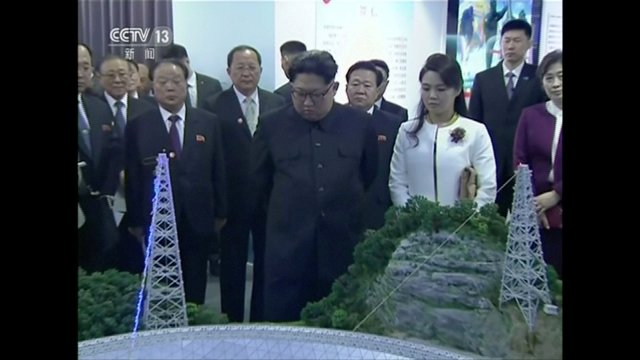 REFILE - ADDING CITY North Korean leader Kim Jong Un and his wife Ri Sol Ju look at an innovations achievement exhibition of the Chinese Academy of Sciences, in this still image taken from video released on March 28, 2018. North Korean leader Kim Jong Un visited Beijing, China, from Sunday to Wednesday on an unofficial visit, China's state news agency Xinhua reported on Wednesday. CCTV via Reuters TV ATTENTION EDITORS - NO RESALES. NO ARCHIVES. CHINA OUT.