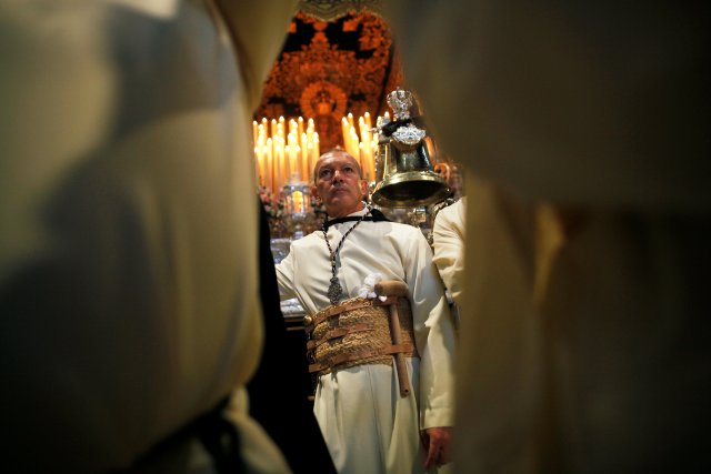 Spanish actor Antonio Banderas looks on inside a church before taking part as a penitent in the "Lagrimas and Favores" brotherhood, during a Palm Sunday procession in Malaga, Spain March 25, 2018. REUTERS/Jon Nazca