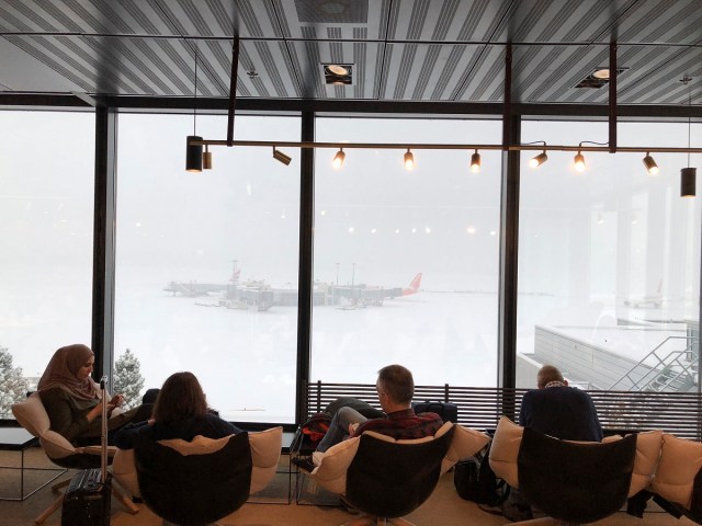 People sit at the airport in the Swiss city of Geneva, Switzerland March 1, 2018 in this picture obtained from social media. FABRICE PERRIN/ WIDE AGENCY /via REUTERS THIS IMAGE HAS BEEN SUPPLIED BY A THIRD PARTY. MANDATORY CREDIT. NO RESALES. NO ARCHIVES. MUST ON SCREEN COURTESY FABRICE PERRIN/ WIDE AGENCY