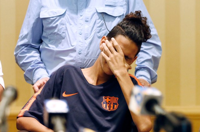 Marjory Stoneman Douglas High School shooting victim Anthony Borges reacts as he listens to a press conference in Plantation, Florida on April 6, 2018. Borges, the last survivor to be released from the hospital, was shot five times when former student, Nikolas Cruz, opened fire at the Florida high school leaving 17 people dead and 15 injured. / AFP PHOTO / RHONA WISE