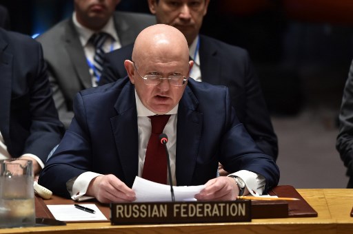 Russian Ambassador to the UN Vasily Nebenzya speaks during UN Security Council meeting, at United Nations Headquarters in New York, on April 14, 2018. The UN Security Council on Saturday opened a meeting at Russia's request to discuss military strikes carried out by the United States, France and Britain on Syria in response to a suspected chemical weapons attack. Russia circulated a draft resolution calling for condemnation of the military action, but Britain's ambassador said the strikes were "both right and legal" to alleviate humanitarian suffering in Syria. / AFP PHOTO / HECTOR RETAMAL