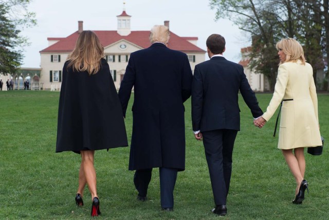 US President Donald Trump and First Lady Melania Trump, and French President Emmanuel Macron and his wife, Brigitte Macron, walk prior to dinner at Mount Vernon, the estate of the first US President George Washington, in Mount Vernon, Virginia, April 23, 2018. / AFP PHOTO / SAUL LOEB