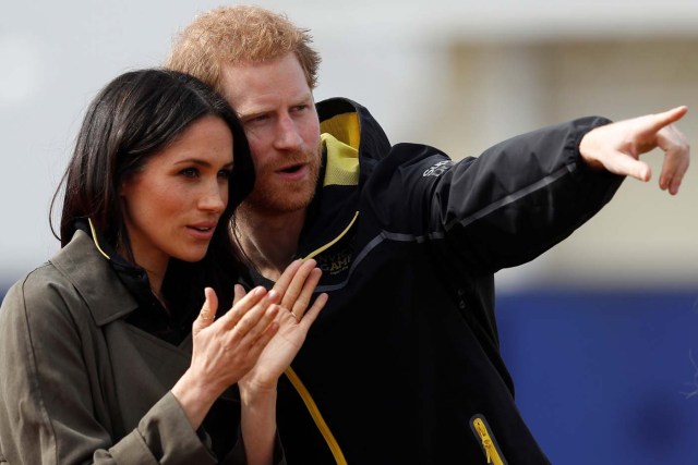 Britain's Prince Harry, Patron of the Invictus Games Foundation, and Meghan Markle watch athletes at the team trials for the Invictus Games Sydney 2018 at the University of Bath Sports Training Village in Bath, Britain, April 6, 2018. REUTERS/Peter Nicholls