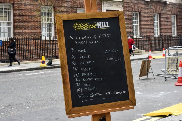 The names and betting odds for the third royal baby of Britain's Prince William and Catherine, Duchess of Cambridge, can be seen written on a board outside the Lindo Wing St Mary's Hospital in west London, Britain, April 13, 2018. REUTERS/Peter Summers