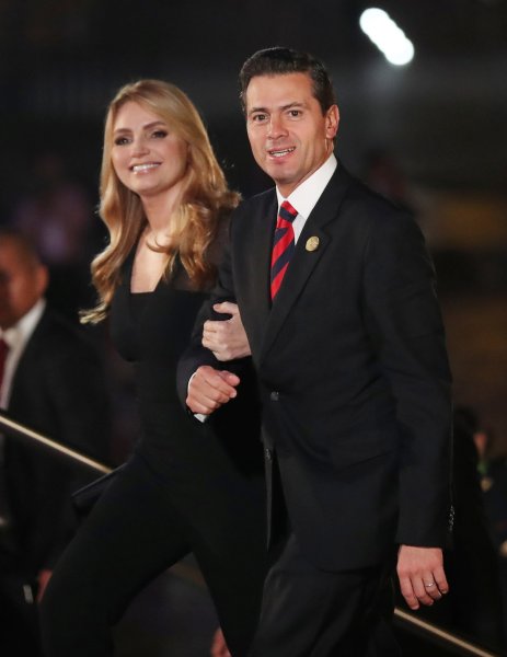 Mexico's President Enrique Pena Nieto and First Lady Angelica Rivera arrive for the inauguration of the VIII Summit of the Americas in Lima, Peru April 13, 2018. REUTERS/Marco Brindicci
