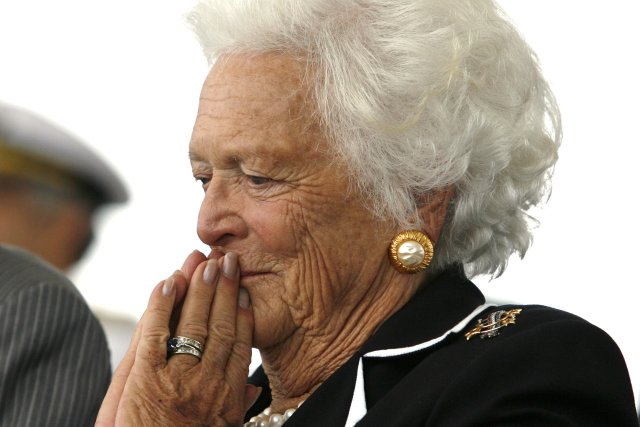 FILE PHOTO: Former first lady Barbara Bush listens to remarks during the christening ceremony of the USS George H.W. Bush at Northrop-Grumman's shipyard in Newport News, Virginia, U.S., October 7, 2006.  REUTERS/Kevin Lamarque/File Photo