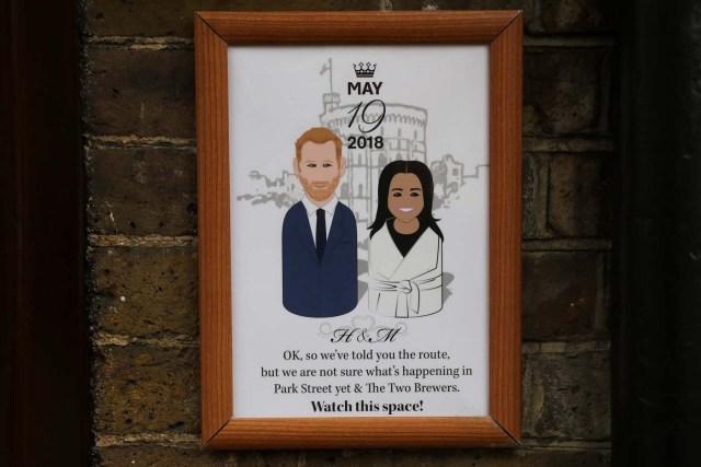 A poster advertising Britain's Prince Harry and his fiancee Meghan Markles' wedding is displayed outside a pub near Windsor Castle in Windsor, Britain, April 1, 2018. Picture taken April 1, 2018. REUTERS/Simon Dawson