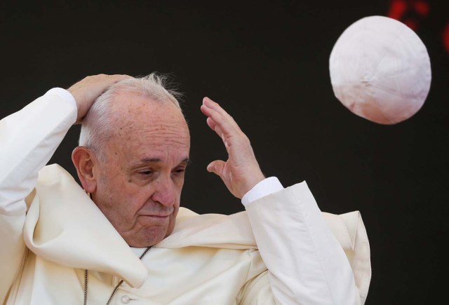 A gust of wind blows Pope Francis's skull cap off during his pastoral visit in Alessano, southern Italy, April 20, 2018. REUTERS/Max Rossi TPX IMAGES OF THE DAY