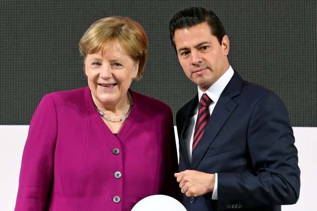 German Chancellor Angela Merkel and Mexican President Enrique Pena Nieto attend an opening tour of the Hannover Messe, the trade fair in Hanover, Germany, April 23, 2018. REUTERS/Fabian Bimmer
