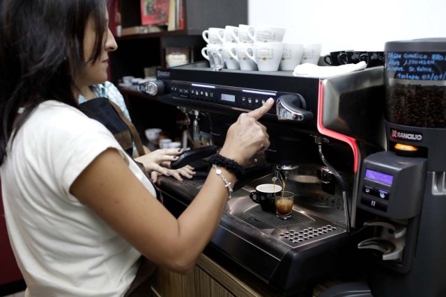 A woman brews espresso coffee at a barista training center in Caracas, Venezuela April 3, 2018. Picture taken April 3, 2018. REUTERS/Marco Bello