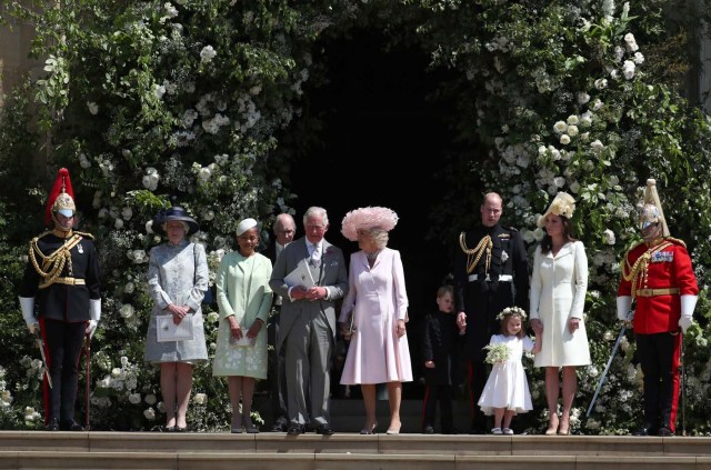 (L-R) Meghan Markle's mother Doria Ragland, Britain's Prince Charles, Prince of Wales, Britain's Camilla, Duchess of Cornwall, Prince George, Britain's Prince William, Prince Harry's niece and bridesmaid Princess Charlotte and Britain's Catherine, Duchess of Cambridge leave after attending the wedding ceremony of Britain's Prince Harry, Duke of Sussex and US actress Meghan Markle at St George's Chapel, Windsor Castle, in Windsor, on May 19, 2018. / AFP PHOTO / POOL / Jane Barlow